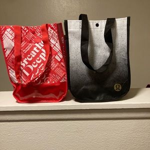 2 Lululemon bags 1 red & 1 gray.